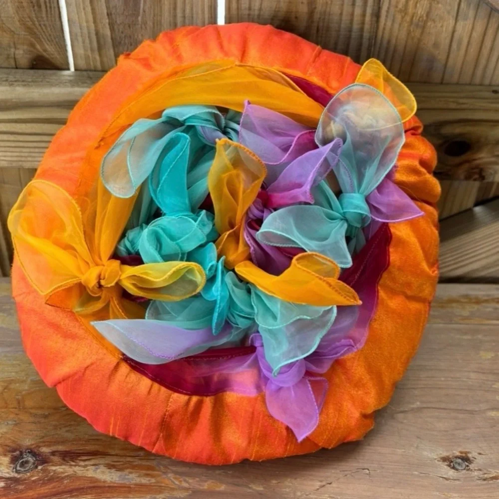 Pier 1 Round Orange Accent Pillow with Chiffon Scarves Tied on Top 14”